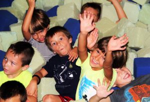 A group of boys enjoys the faom pit at a birthday party